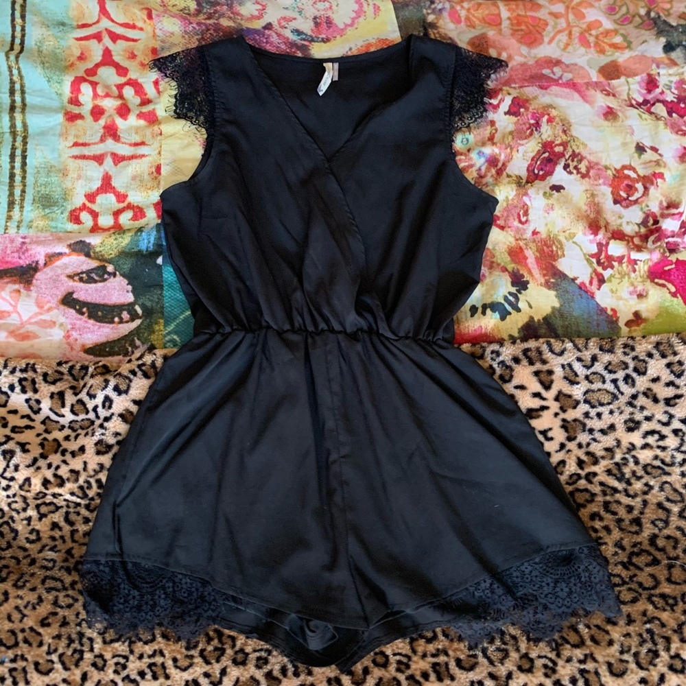 Unique black romper with lace detail